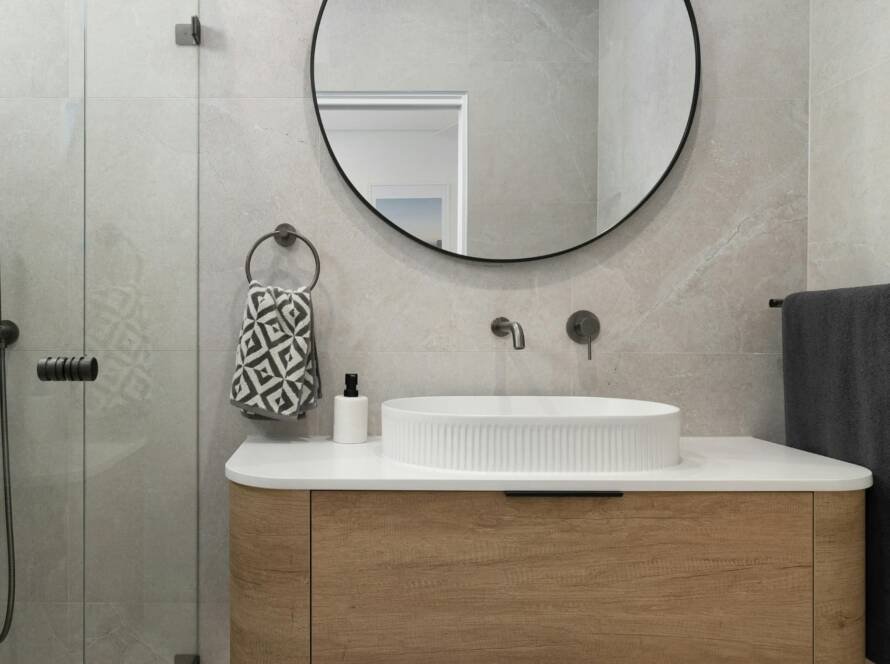 Mueble de baño con lavabo y espejo